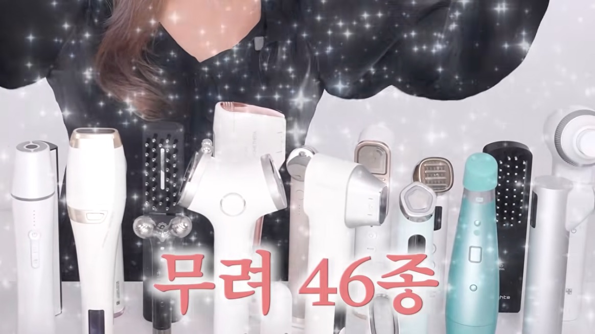The YouTuber’s collection of at-home beauty devices with on-screen text saying 46 devices (video screenshot)