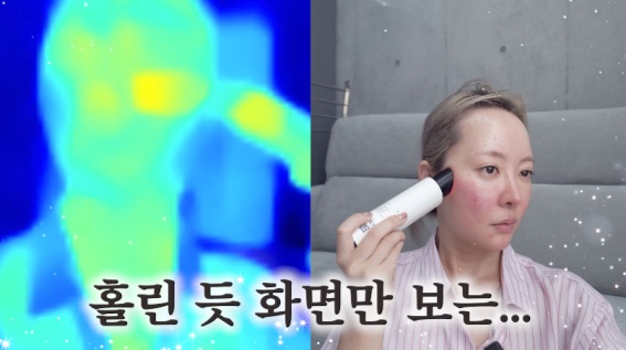 Thermal-camera view next to the YouTuber holding an RF device against her cheek (video screenshot)
