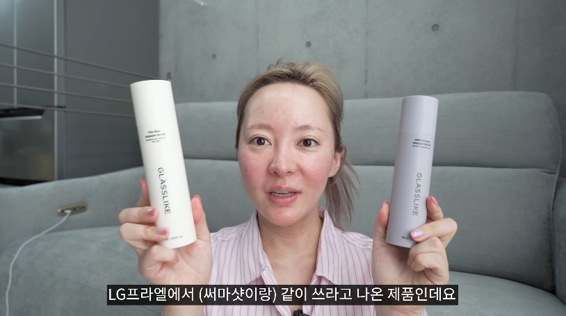 The YouTuber holding two Glasslike ampoule serums made to be used with the LG Pra.L device (video screenshot)